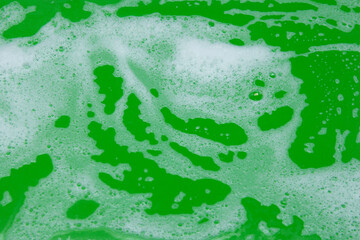 Green background, white foam detergent