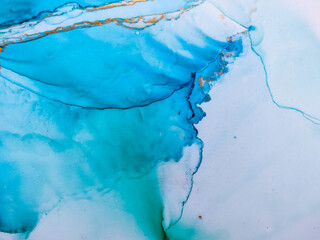 Background texture of alcohol ink in blue color.  Abstract  paint with drops and stains.