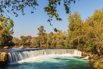 Turquoise water of Manavgat River flowing over the Manavgat Waterfall.