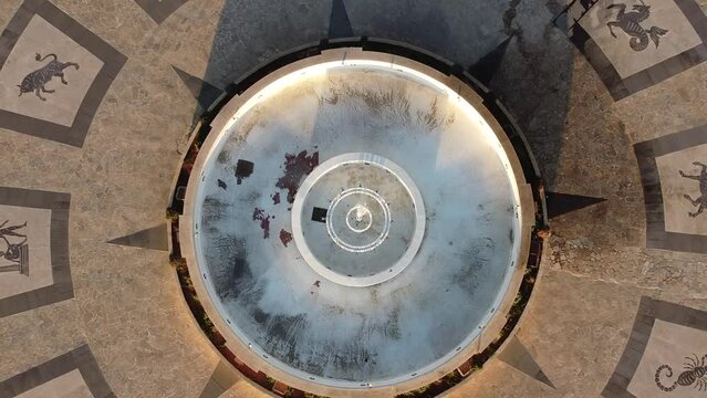 Top view aerial flight over the fountain of the zodiac on the promenade of ostia lido, Rome