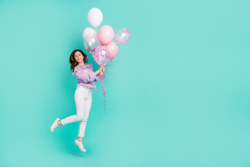 Fototapeta na wymiar Full size portrait of cheerful pretty lady hold air balloon enjoy occasion event isolated on turquoise color background