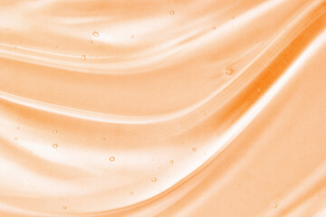 Serum gel texture background. Yellow cosmetic transparent cream swirl with bubbles. Beauty skin...