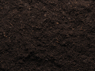 Texture of a planting bed or peat free potting soil, view from above, garden time or planting time...