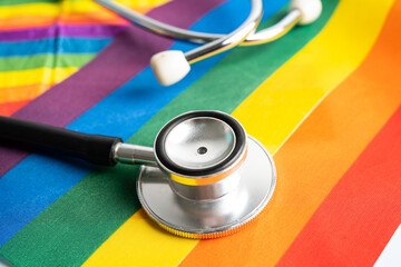 Black stethoscope on rainbow flag background, symbol of LGBT pride month  celebrate annual in June social, symbol of gay, lesbian, bisexual, transgender, human rights and peace.