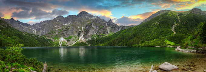 Panorama of Tatra mountains by the Eye of the Sea lake at sunset, Poland
