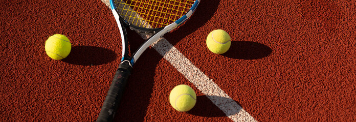 Tennis Ball with Racket on the racket in tennis court