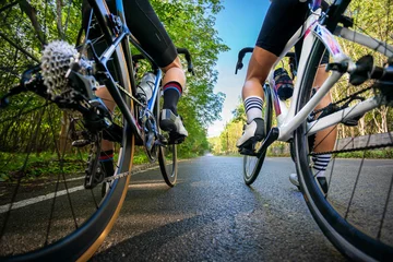 Fotobehang cycling athlete prepare for ride bicycle on street, road, with high speed for exercise hobby and competition in professional tour © kunchainub