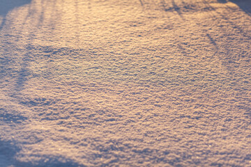 Clean, white snow close-up. Winter background. Snow surface. Fresh fluffy white snow texture.White snowflakes. 