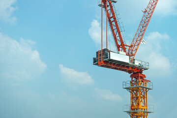 Yellow lifting crane Prepare to start In blue sky background