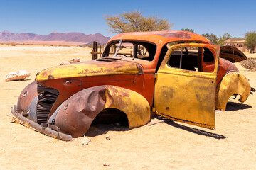 rusted colorful body of old car near solitaire, namibia