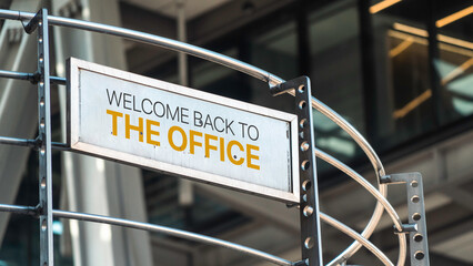 Welcome back to the Office Sign in front of large city center office