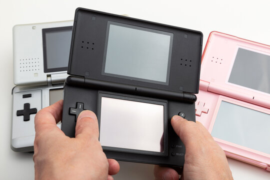 Playing on nintendo ds lite Stock-Foto | Adobe Stock