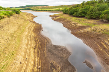 Leighton Reservoir in Nidderdale, North Yorkshire, UK, with very low water levels following a...