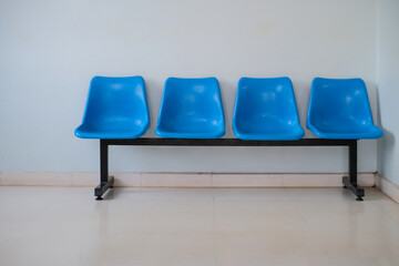 Plastic chairs arranged for sitting in the building.