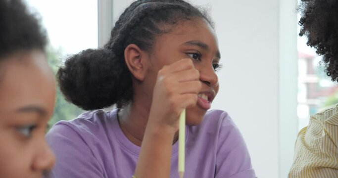 African black children students learning discuss and express in the classroom. group of school kids talking during lesson in classroom