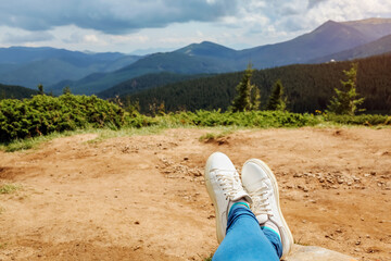 Fototapeta premium Hiking in Carpathian mountains. Hiker woman relaxing enjoying landscape. Traveling in summer Ukraine