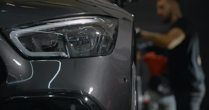 Process of the nano ceramic coating application at the car detailing service center, 4k 60p Prores