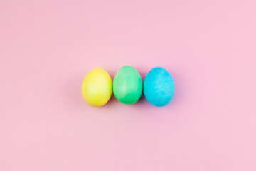 Easter pink composition. Easter eggs on pastel pink background. Minimal concept of Easter.