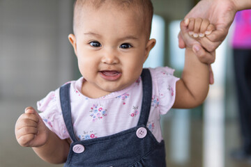 close-up of malay toddler learning to walk
