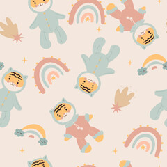 Seamless pattern with cute tiger cubs and rainbows. Vector graphics.