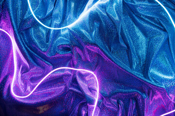 Violet and blue neon lights with glitter fabric background. Vaporwave futuristic template.
