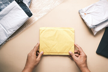  yellow paper bubble envelope on table 