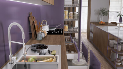 Obraz na płótnie Canvas Cozy purple and wooden kitchen close up, open drawers with pottery and utensils. Sink with fruit, induction hob with pots, wooden cutting boards. Contemporary interior design concept