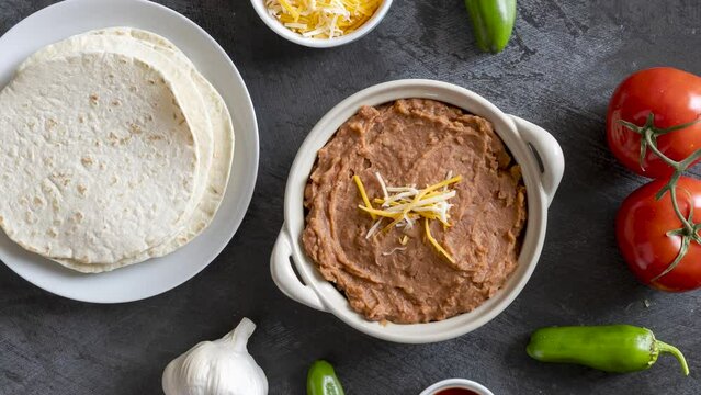 Rotating Refried Beans and Flour Tortillas