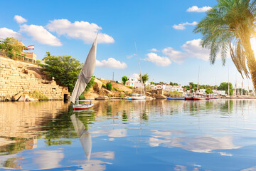 Fototapeta na wymiar The Nile view, sailboat and banks of Aswan, Egypt