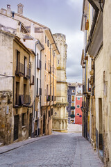 Fototapeta na wymiar Narrow alley with old houses of many years in the city of Cuenca, Spain.