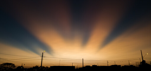 sunset seen from a village
