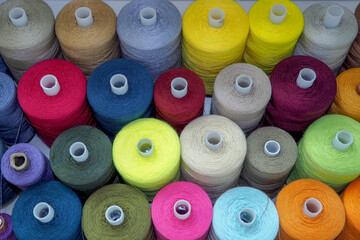 Sewing threads as a multicolored background close up