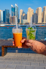 two cold drink green and orange delicious very