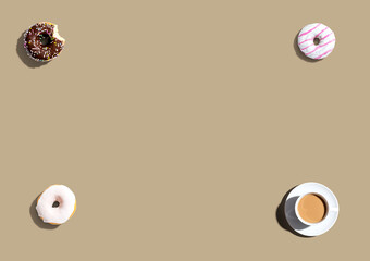 Donuts and a cup of coffee - overhead view flat lay