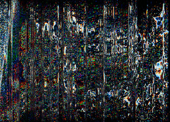 Futuristic glitch. Color noise. Digital distortion. Lcd damage. Blue orange green pixel grain artifact texture on dark black abstract background.