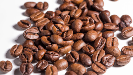 Heap of fresh roasted coffee beans isolated on white background as package design elements