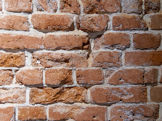 Background. Brick wall. Red brick with cement solution