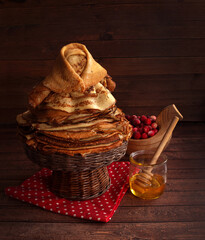 The woman from pancakes. The figure of Pancake Maslenitsa. Homemade pancakes, delicious food. A traditional dish of Russian Maslenitsa. - 489054585