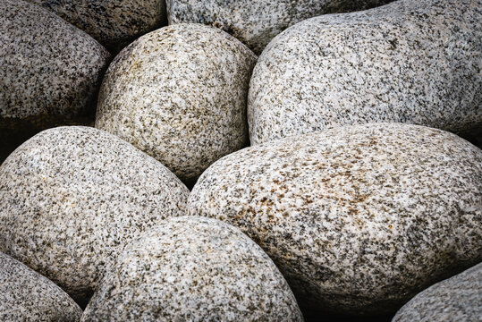 Full frame natural abstract background with round granite stones in vintage style. High resolution image, perfect for interior decoration in Healing by Nature Fine Art Design style.