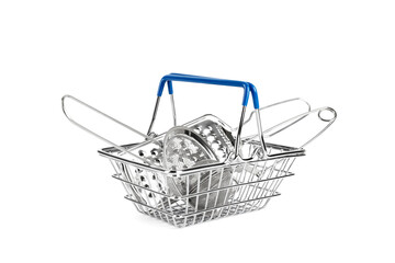Kitchenware in shopping cart isolated on white background. Shopping basket, strainer, grater and tea strainer on white background
