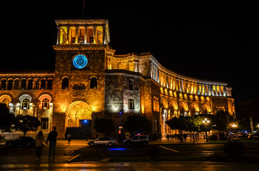 Fototapeta premium Government building with clock tower located on Republic Square at night. Yerevan, Armenia.