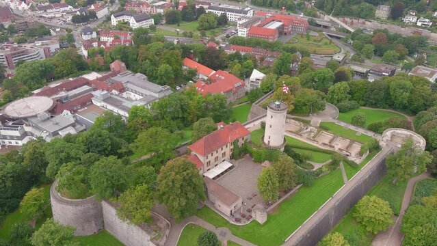 Bielefeld: Aerial view of city in Germany, medieval fort Sparrenburg Castle (Burg und Festung Sparrenberg) - landscape panorama of Europe from above
\