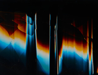Digital glitch. Fractured overlay. Distressed screen texture. Blue orange white glow artifacts dust...
