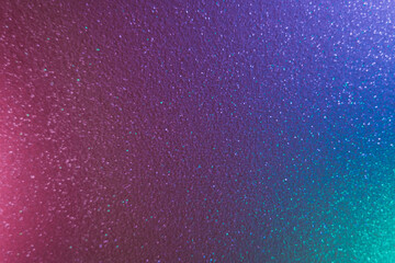 Color gradient background. Grain texture. Defocused holographic radiance. Blur neon light pink blue green glitter glow on iridescent shimmering abstract overlay.