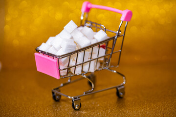 Small shopping cart with sugar cubes