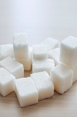 close up of sugar cubes. The concept of unhealthy eating. Vertical photography.