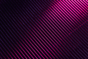 Corrugated texture. Neon light background. Grooved metal surface. Fluorescent pink purple color...