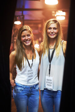 Two Young Women With Backstage Passes At A Concert. This Concert Was Created For The Sole Purpose Of This Photo Shoot, Featuring 300 Models And 3 Live Bands. All People In This Shoot Are Model