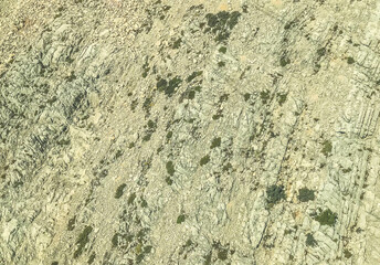 natural rock. high mountain with plants in a warm country. vacation in the mountains. mountain of stones, sand on the surface. relaxation in silence