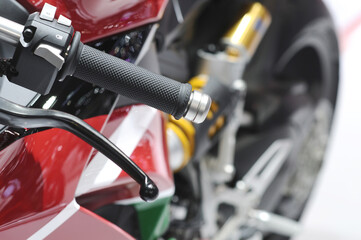 Motorcycle accelerator handle. Racers twist the throttle to increase their speed in the world motorcycle championship.